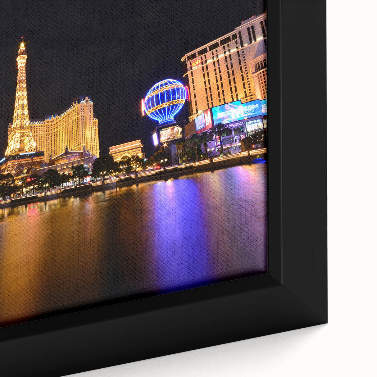 Black wall art featuring a textured depiction of the Las Vegas skyline with vibrant colors on a framed canvas.