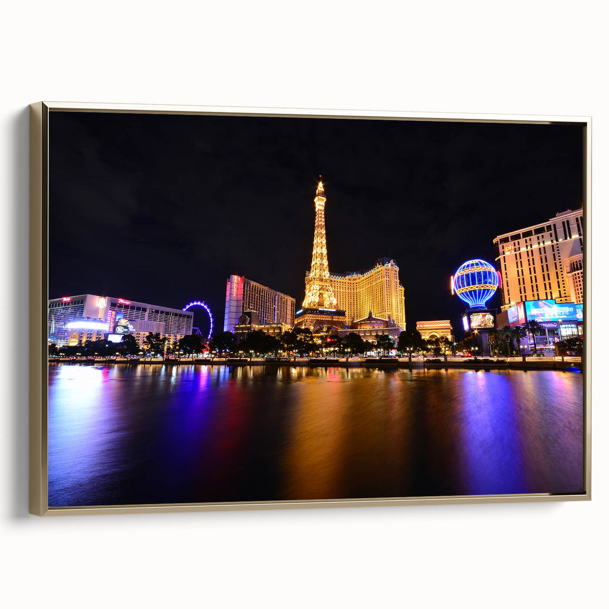 Framed canvas of Las Vegas landscape in vintage poster style, featuring black and gold tones, ideal for bedroom wall art.