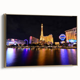 Framed canvas of Las Vegas landscape in vintage poster style, featuring black and gold tones, ideal for bedroom wall art.