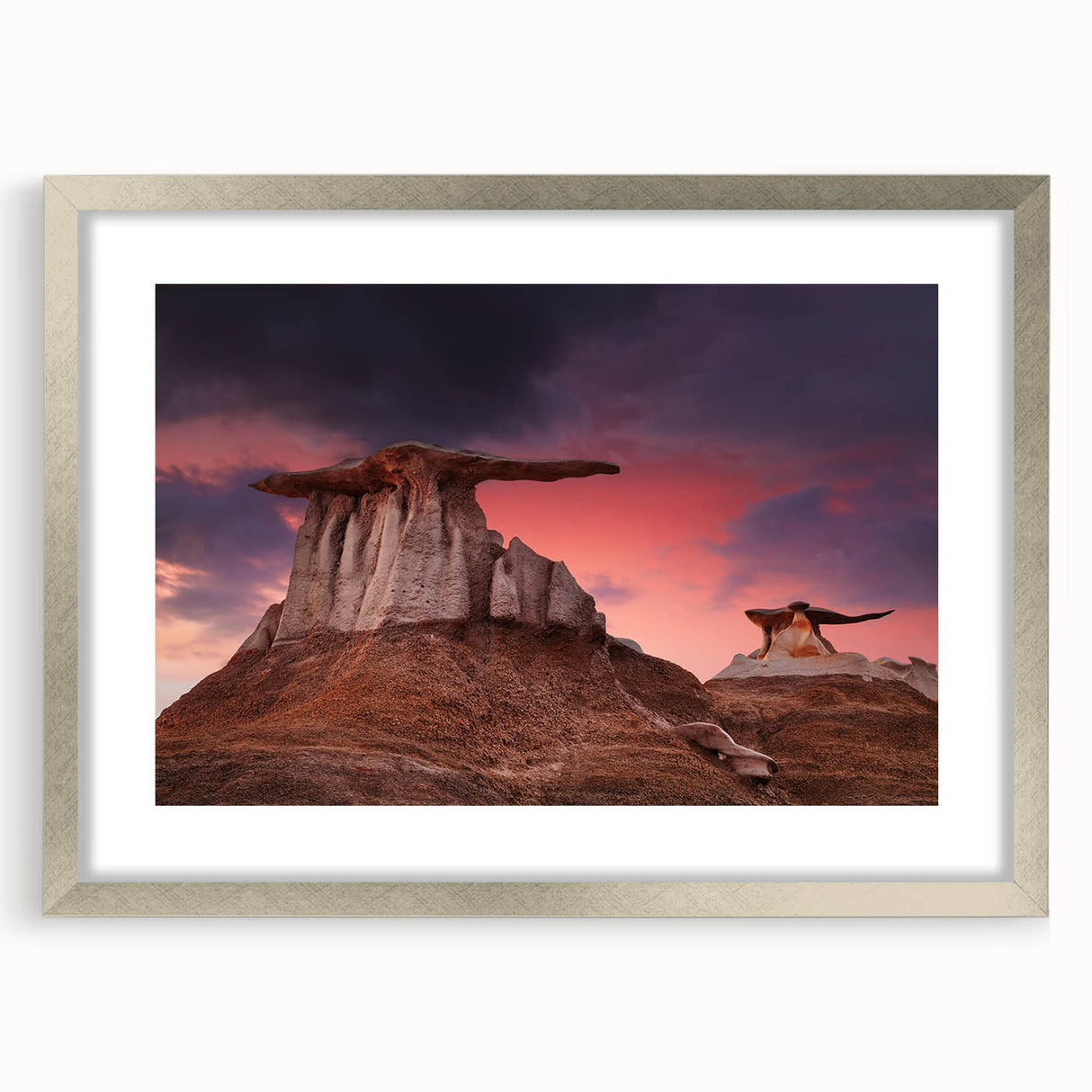 Textured abstract art print featuring earthy tones, framed in silver, ideal for bedroom art.