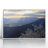 Art deco style poster of the Blue Ridge in North Carolina, with subdued blue and green hues, framed in white acrylic.