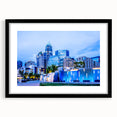 Abstract art print of Charlotte skyline in vibrant, colorful hues on a large framed canvas, ideal for living room decor.