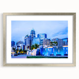 Textured abstract art print of Charlotte skyline, in muted gray and silver tones, framed with a mat.