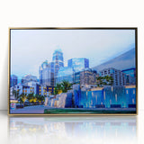 Mid-century modernist art of Charlotte skyline in gold and blue tones on framed acrylic, suitable for modern art wall decor.