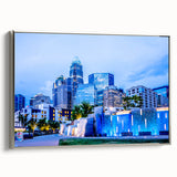 Framed canvas of a colorful Charlotte, North Carolina skyline, ideal for modern living room decor.