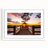 Abstract art print of the Outer Banks with cool blue and green hues on a framed white mat, ideal for dining room decor.