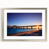 Textured abstract art print of Long Island scenery in muted blues and grays, framed in silver, ideal for bedroom ambiance.