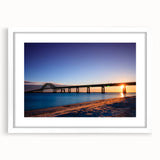 Abstract art print of Long Island scenery in muted blue and white tones, framed with a white mat.