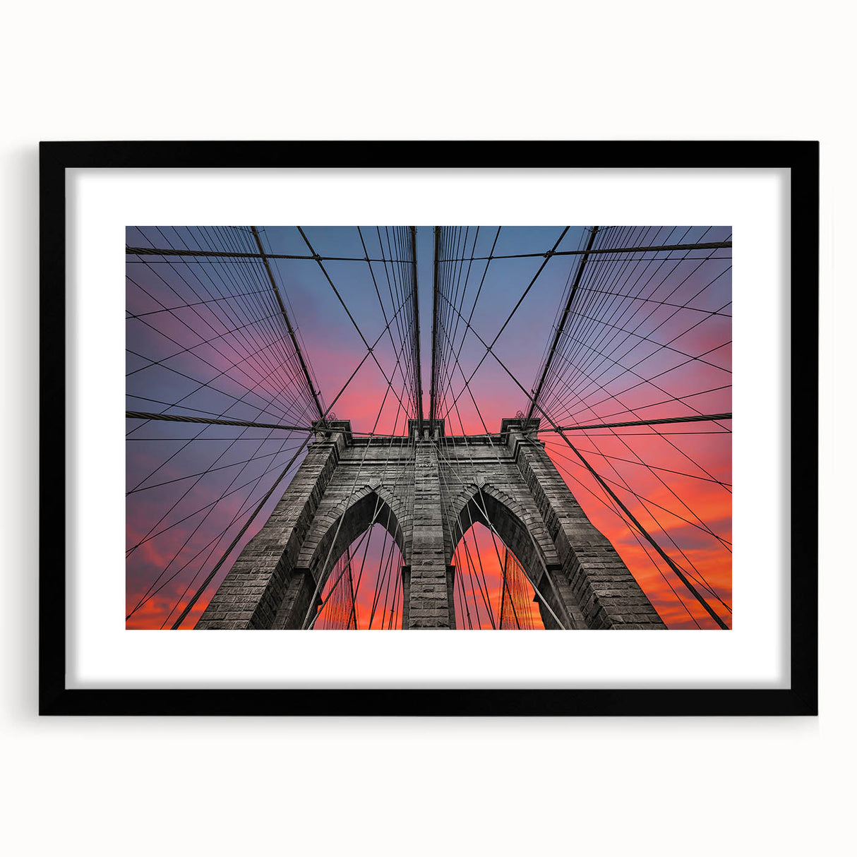 Colorful abstract art print of Brooklyn Bridge in vibrant blues and oranges on a large canvas, ideal for living room decor.