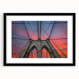 Colorful abstract art print of Brooklyn Bridge in vibrant blues and oranges on a large canvas, ideal for living room decor.