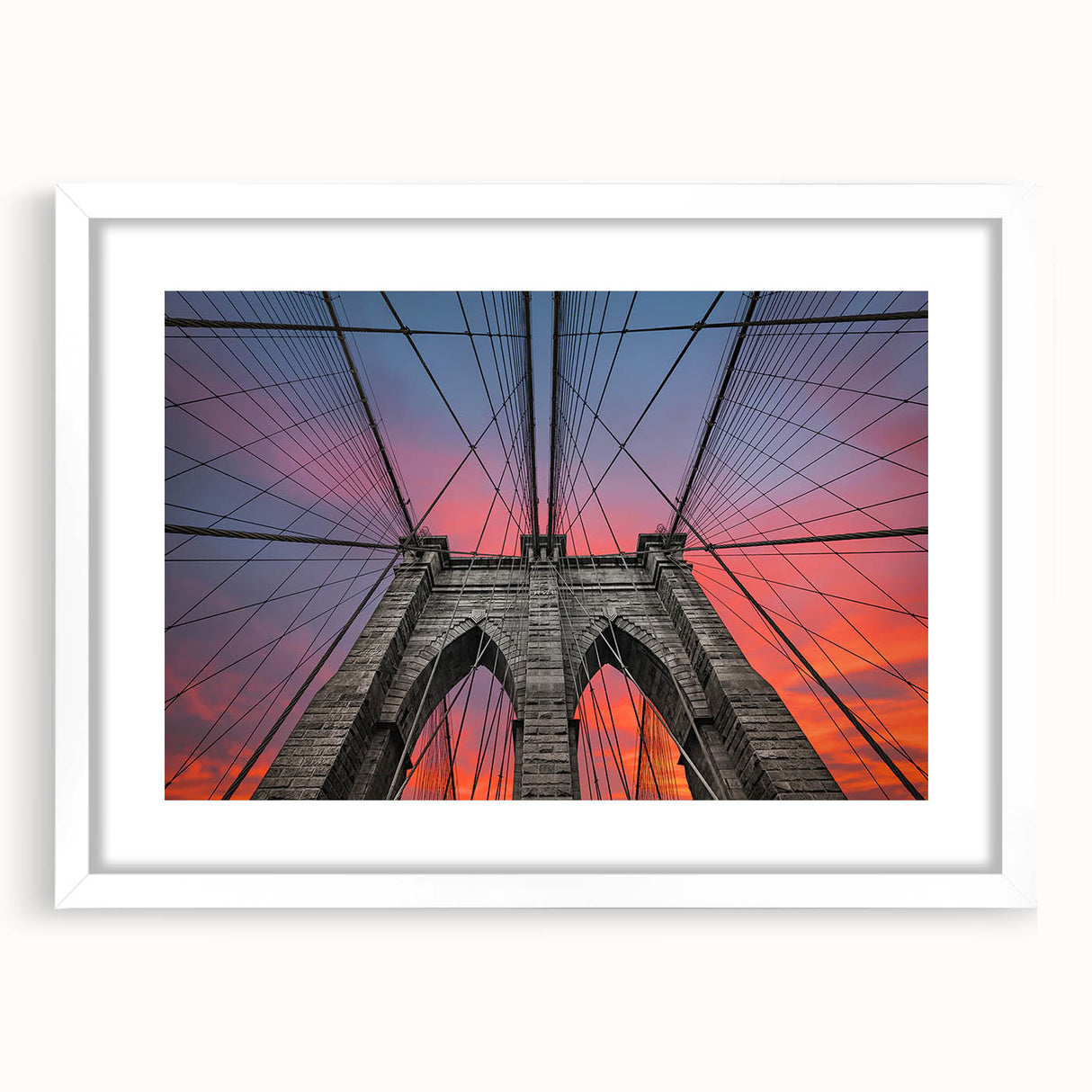 Abstract art print of the Brooklyn Bridge in muted gray and blue tones on a framed white canvas.