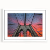 Abstract art print of the Brooklyn Bridge in muted gray and blue tones on a framed white canvas.