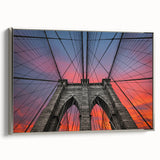Framed canvas featuring a vintage-style landscape art painting of the Brooklyn Bridge in black with colorful accents.