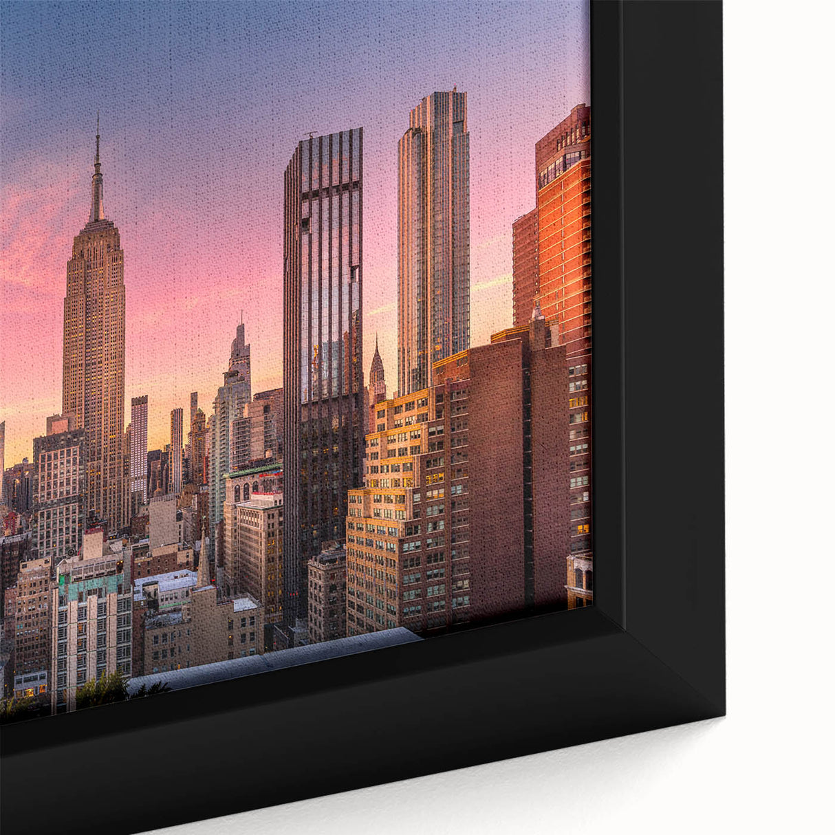 Close-up of a black wall art featuring a textured depiction of the Chrysler Building on framed canvas.