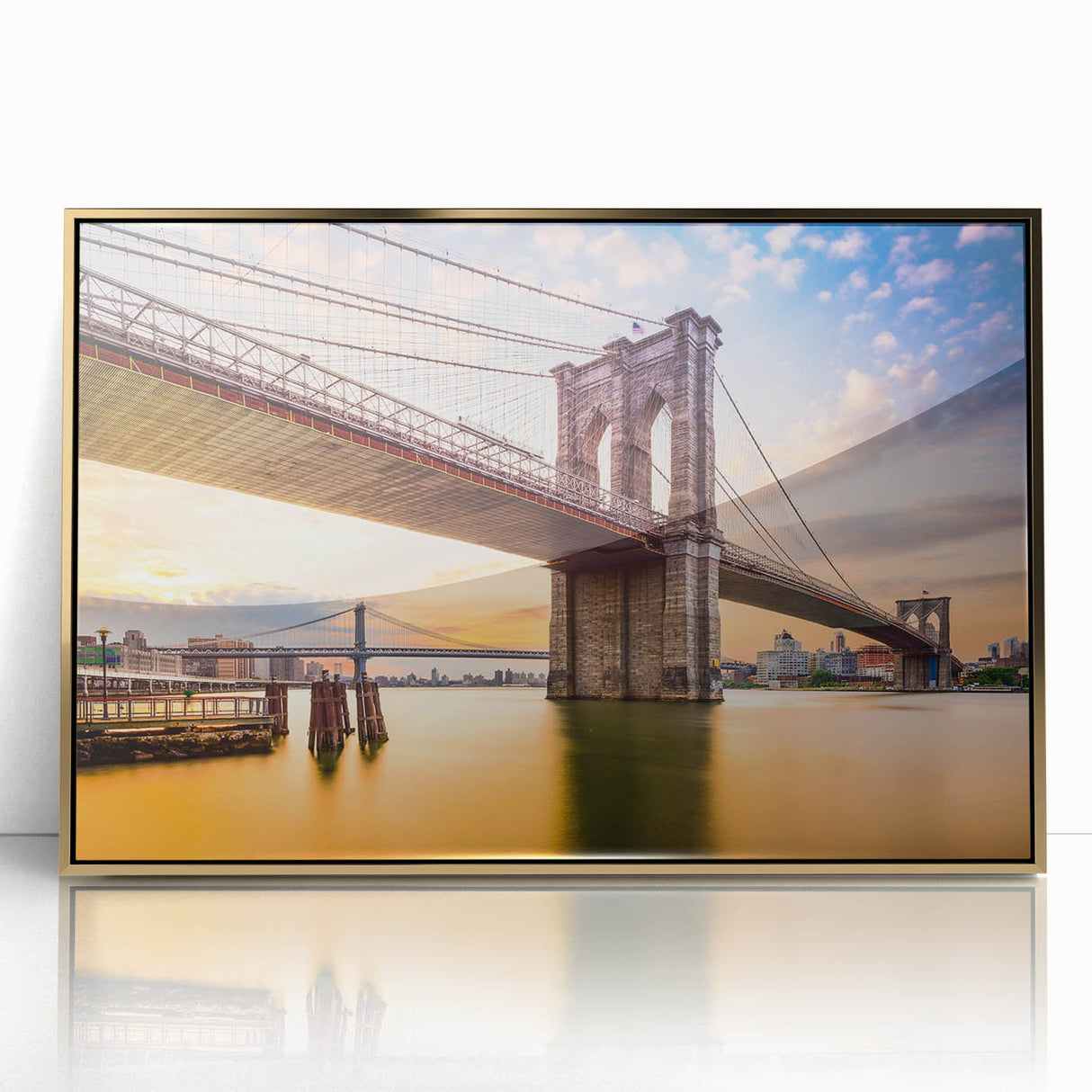 Acrylic print of the Manhattan Bridge in muted gray tones, framed in gold, ideal for modern art wall decor.