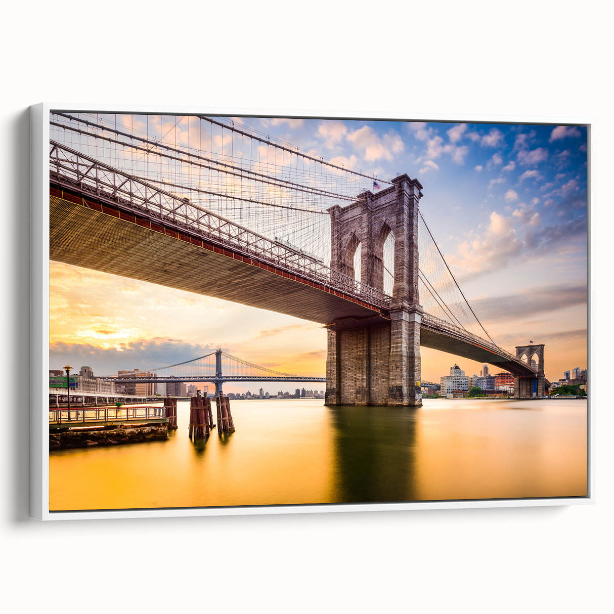Framed canvas of vintage poster art featuring the Manhattan Bridge in black with colorful accents.