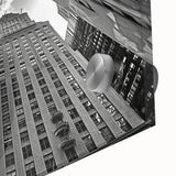 Large abstract wall art depicting the NYC Rockefeller scene in muted colors on acrylic glass, ideal for dining room ambiance.