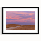 Abstract art print of vibrant, colorful scenery, textured finish on a large framed canvas, ideal for living room decor.