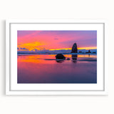 Abstract art print of Cannon Beach, Oregon, in muted gray tones on a white framed poster.