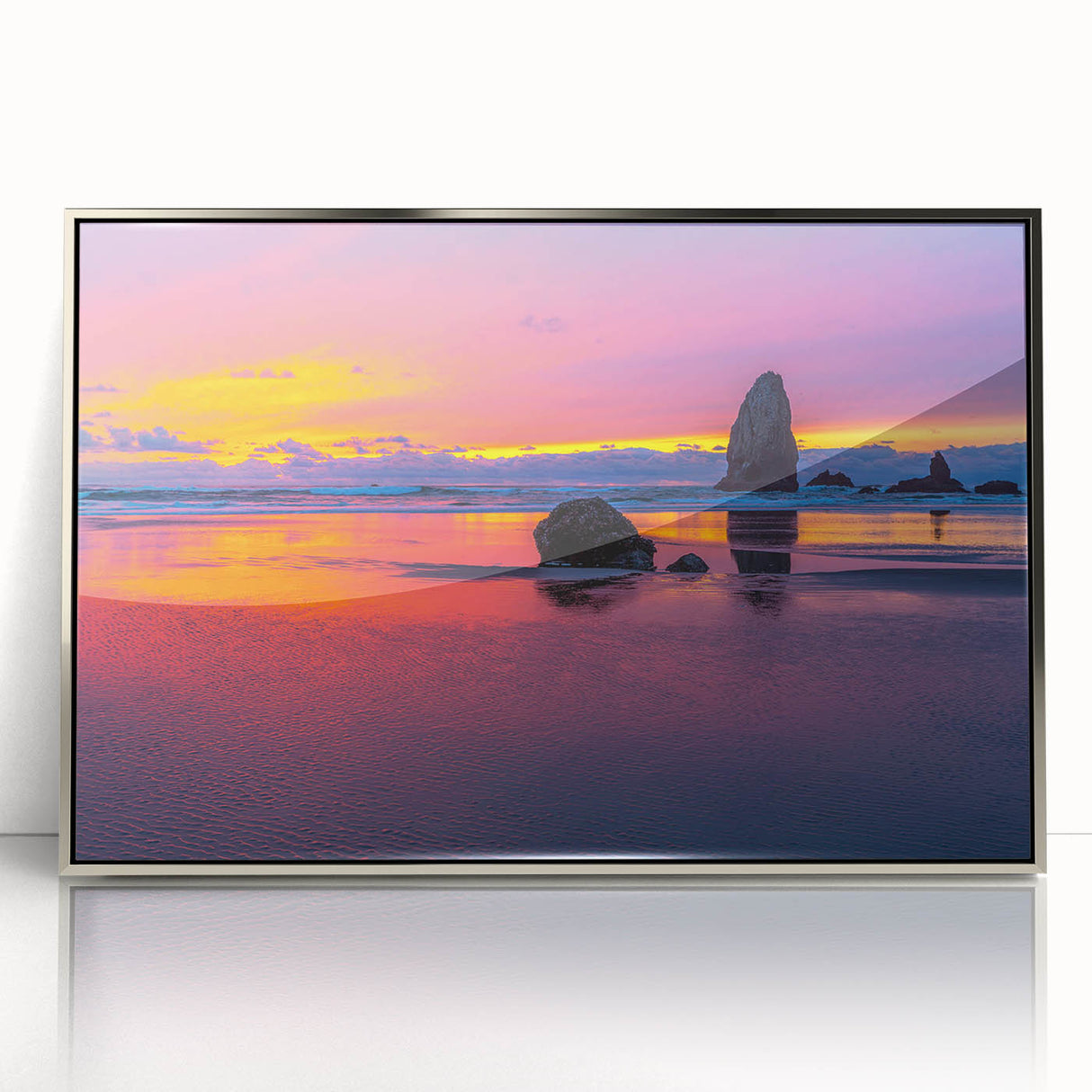 Mid-century modernist art depicting Oregon's Cannon Beach in muted tones on a silver-framed acrylic print.