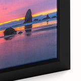 Close-up of textured black wall art featuring Cannon Beach, Oregon, with colorful accents on a framed canvas.