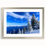 Textured art of Crater Lake in muted blue and gray tones on a framed silver mat, suitable for bedroom wall decor.