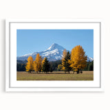 Abstract art print of Mount Hood in muted blue and green tones on a framed white mat, suitable for dining room decor.