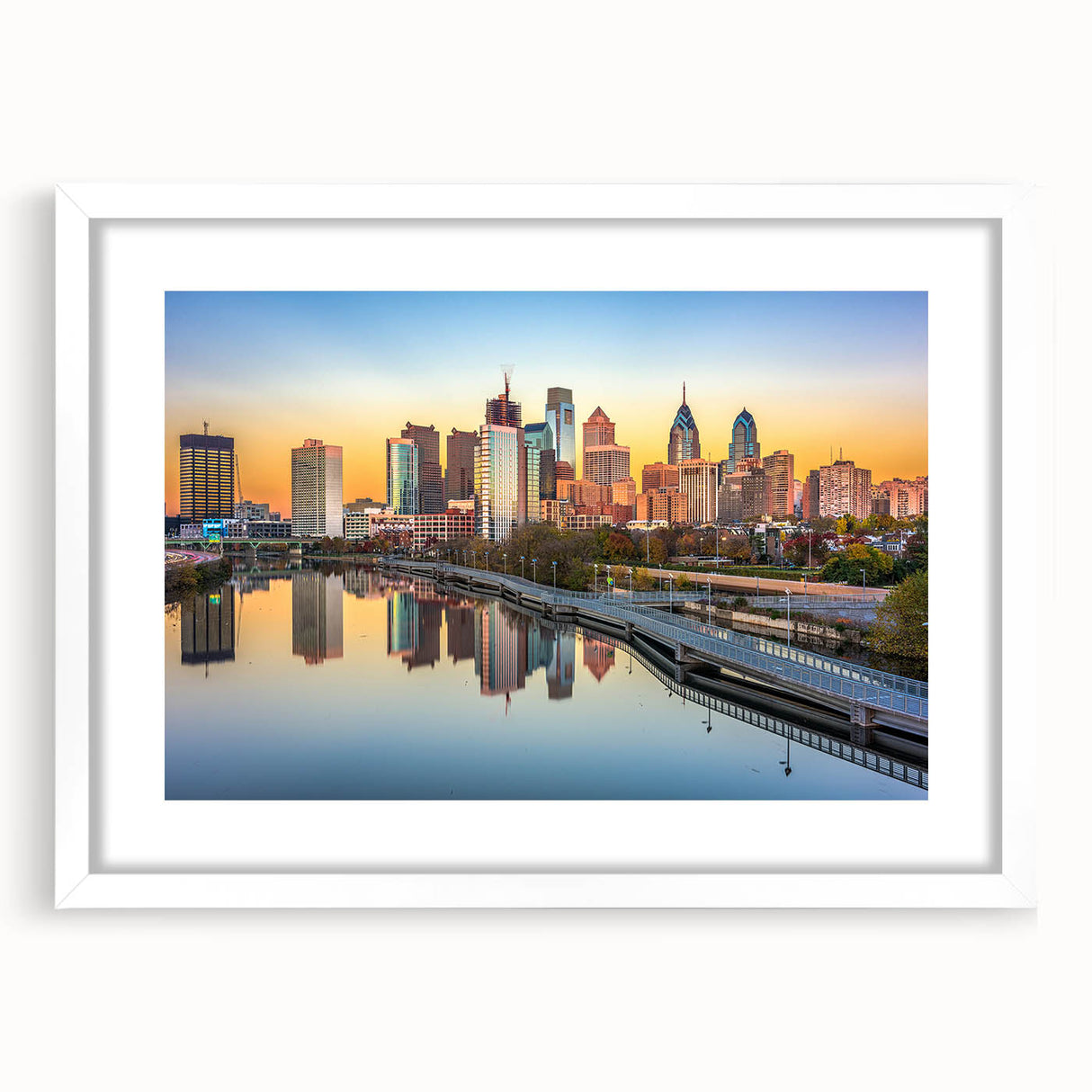 Abstract art print of Philadelphia skyline in muted gray and blue tones on a framed white mat, ideal for dining room decor.
