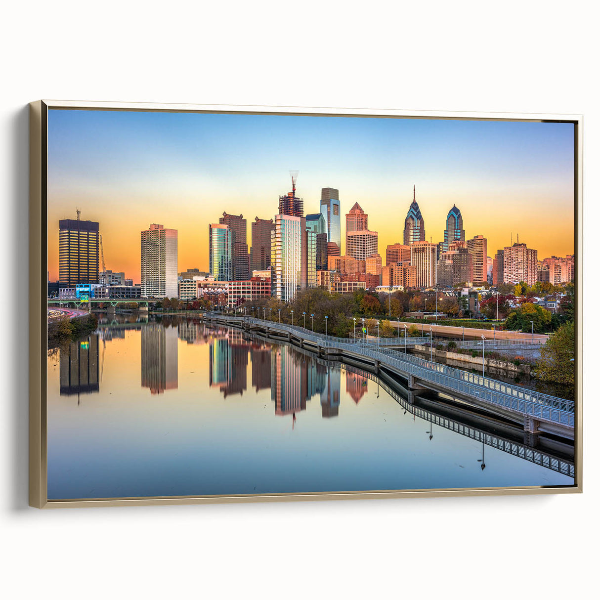 Framed canvas of Philadelphia landscape in vintage poster style, featuring muted gold and black tones.