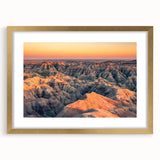 Extra large abstract art print of South Dakota Badlands in textured style, with vibrant earth tones, framed in gold.
