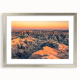 Textured art print of South Dakota Badlands in abstract style, featuring earthy tones on a silver-framed mat.