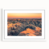 Abstract art print of South Dakota Badlands in muted earth tones on a white-framed mat, suitable for dining room decor.