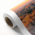 Art deco poster of South Dakota Badlands in muted earth tones on rolled canvas.