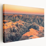 Large art print of South Dakota Badlands on stretched canvas, featuring earthy red and brown tones.