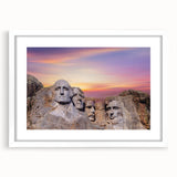 Abstract art print of Mt. Rushmore in muted gray tones on a framed white mat, ideal for dining room decor.