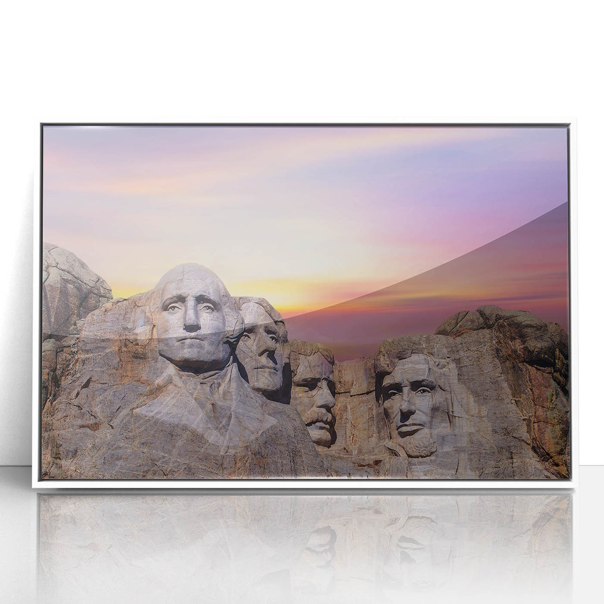Acrylic print of Mt. Rushmore in muted grayscale, framed in white, suitable for modern art wall decor.