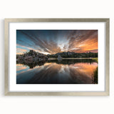 Textured abstract art print of South Dakota scenery in muted earth tones, framed in silver, ideal for bedroom decor.