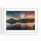 Abstract art print depicting South Dakota scenery in muted earth tones, framed with a white mat.