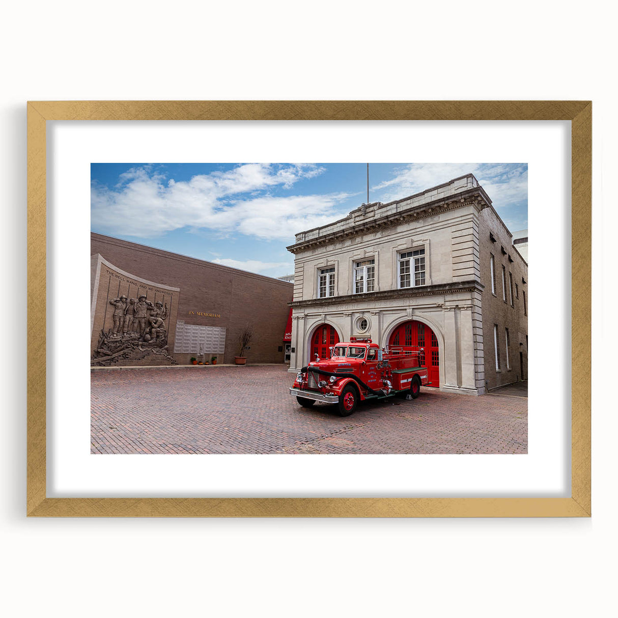 Abstract art print of Memphis scenery in textured gold frame, featuring muted earth tones.