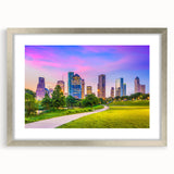 Textured art print of abstract Houston skyline in muted gray and silver tones, framed in silver, suitable for bedroom decor.