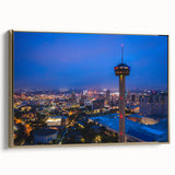 Framed canvas of San Antonio landscape in vintage poster style, featuring muted gold and black tones.
