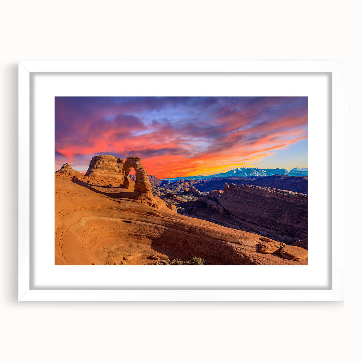 Abstract art print of Arches National Park in muted earth tones on a framed white mat, ideal for dining room decor.