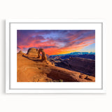 Abstract art print of Arches National Park in muted earth tones on a framed white mat, ideal for dining room decor.