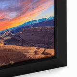 Close-up of a textured black wall art featuring colorful Arches National Park scenery on a framed canvas.