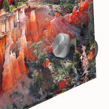 Large abstract depiction of Bryce Canyon in muted orange and red tones on acrylic glass, ideal for dining room art.