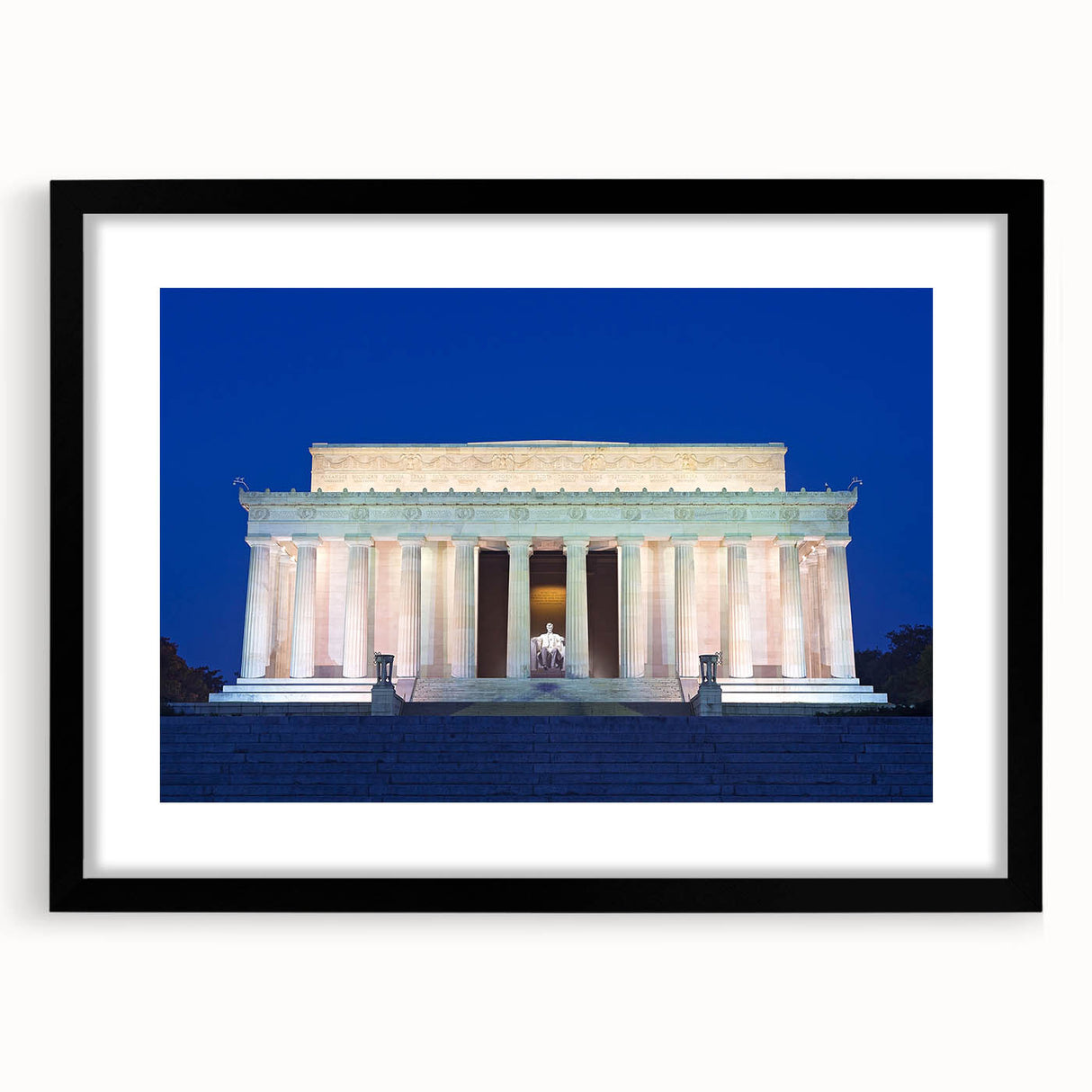 Colorful abstract art print of the Washington DC Lincoln Memorial, in vibrant hues on a textured canvas, framed in black.