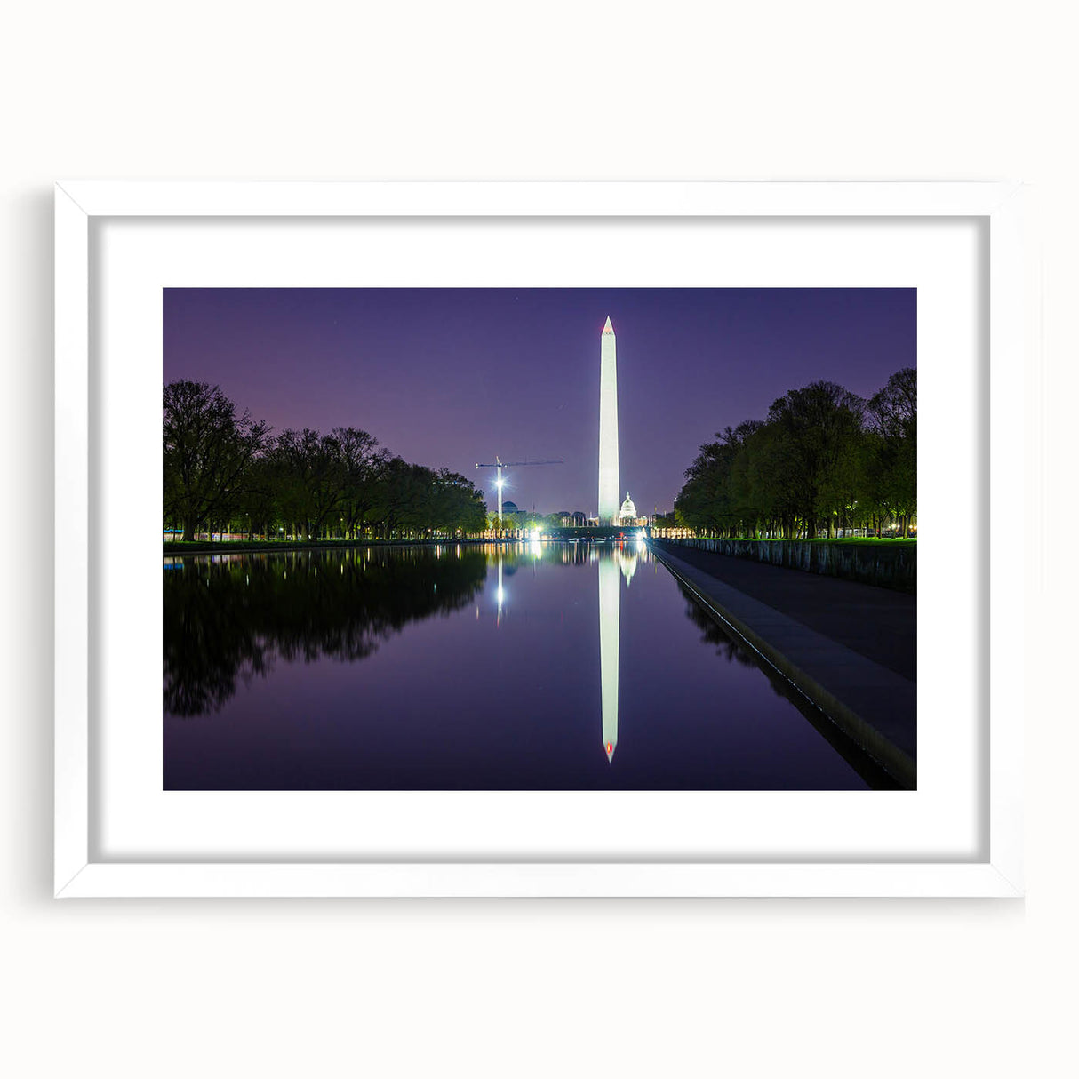 Abstract art print of Washington DC monuments in muted gray, framed with a white mat, suitable for dining room decor.