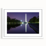 Abstract art print of Washington DC monuments in muted gray, framed with a white mat, suitable for dining room decor.
