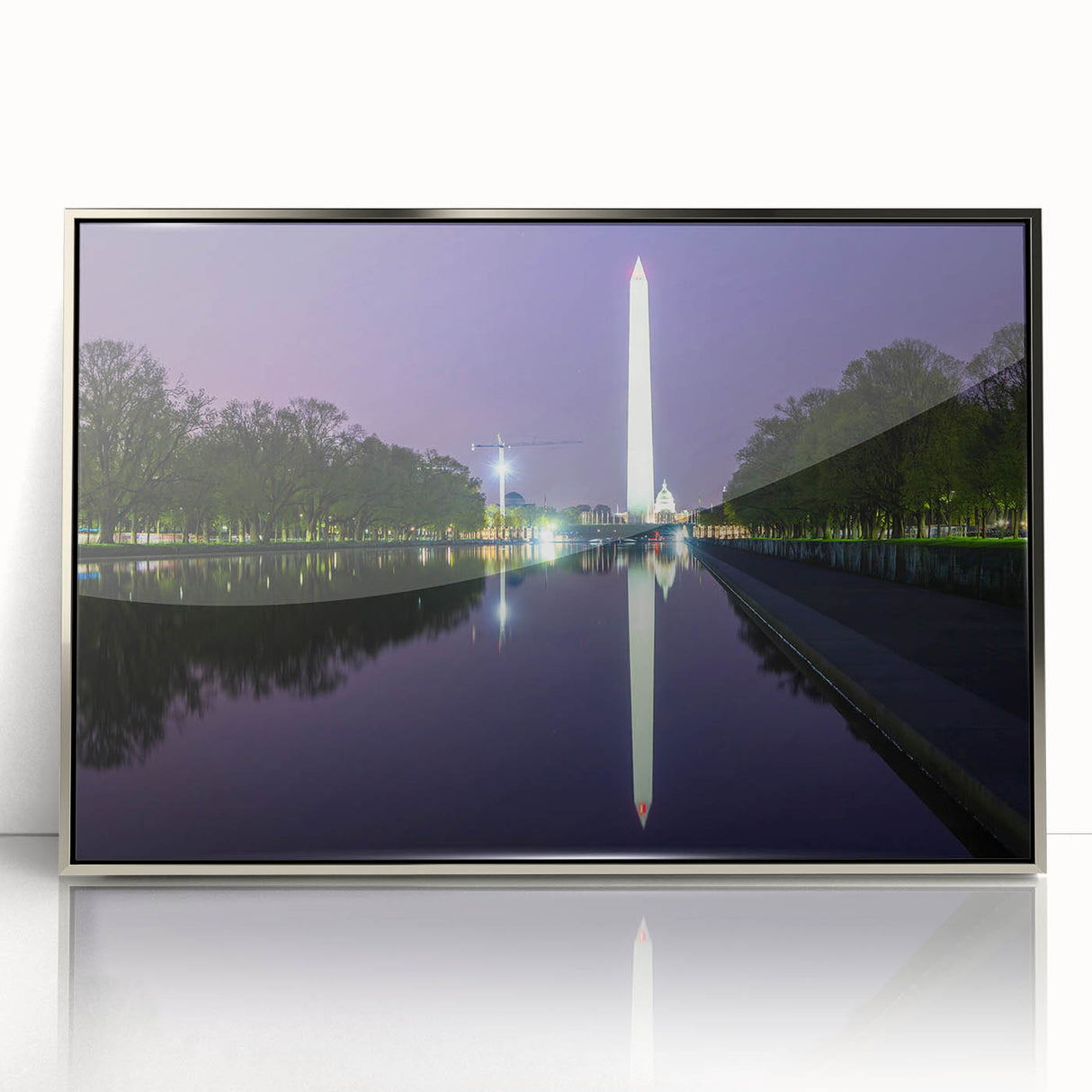 Mid-century modernist art depicting the Washington DC monument in muted gray tones, framed in silver acrylic.