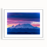 Abstract art print of Mount Rainier in muted blue and gray tones on a framed white canvas.